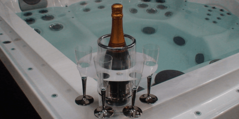 Wine bottle and glass placed on the hot tub